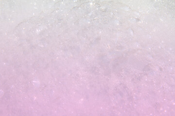 Abstract white and pink colors background of bokeh lights or bubbles in soft spring colors. Shampoo bubbles texture.