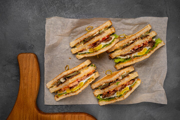 Four sandwiches on the board