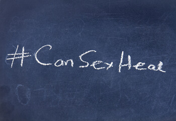 Fototapeta premium The term #CanSexHeal displayed on a blackboard