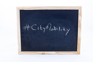 The term #CityMobility displayed on a blackboard