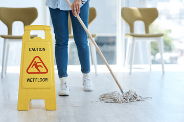 Mopping the floors is so cathartic. Shot of an anonymous woman mopping her floors at home.