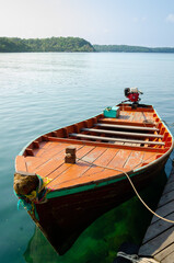 Thai traditional wooden longtail boat at pier. Koh Kood island, Thailand.