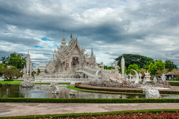 Fototapeta na wymiar background Wat Rong Khun The White Temple and pond with fish, in Chiang Rai, Thailand