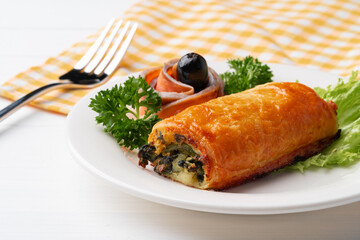 Traditional Russian pie or patty on white plate