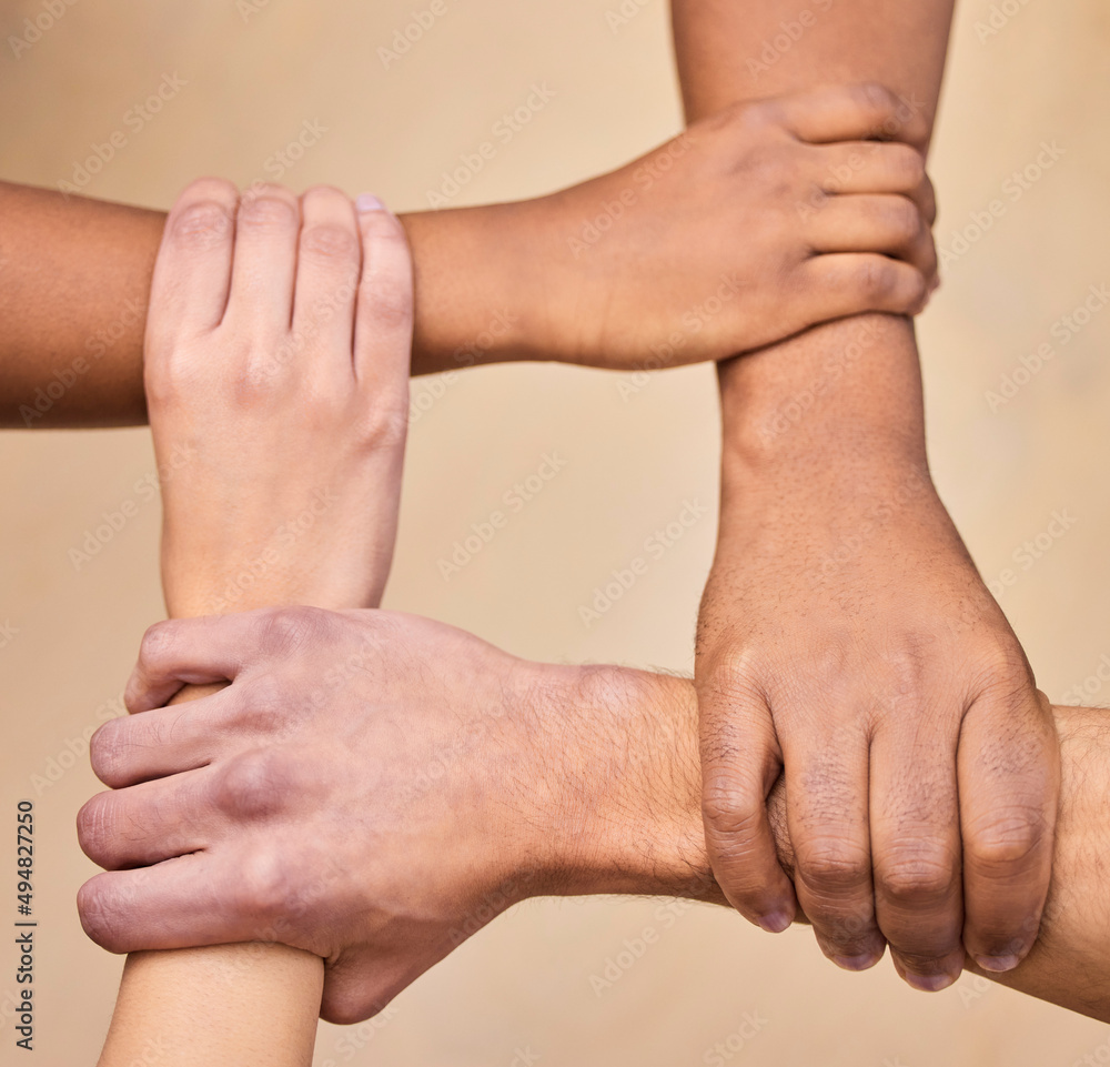 Poster support first, succeed second. high angle shot of a diverse group of businesspeople holding each oth
