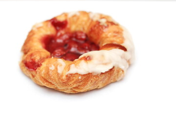 Cherry filled Danish or Danish bread placed on a white background.