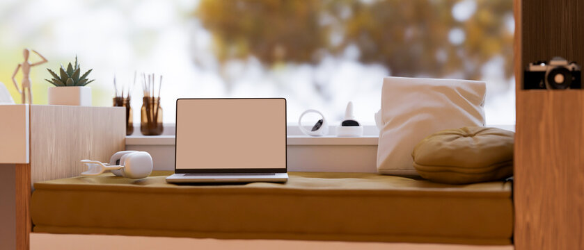Laptop White Screen Mockup On Modern Cozy Couch