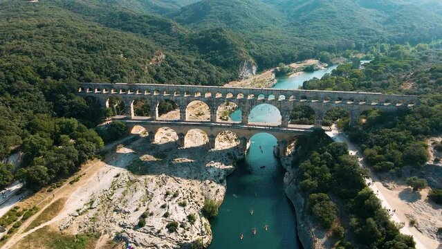 The Pont du Gard is an ancient Roman aqueduct bridge built in the first century AD. It crosses the river Gardon in southern France. Seen from above.
