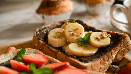 Close-up, Yummy whole grain toast with slide banana and dark chocolate cream