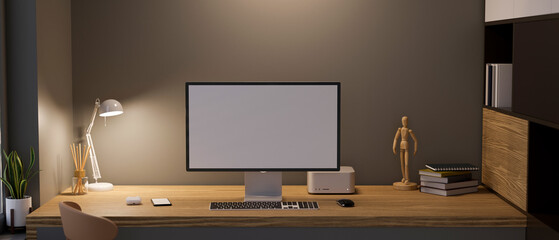 Modern stylish office studio workspace with computer on wooden table against dark wall.