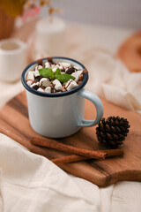 Hot chocolate with marshmallow candies in a white ceramic cup