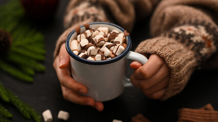 Close-up image, A tasty hot melted chocolate cup in a woman's hand.