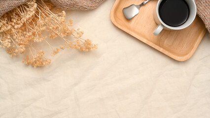 Minimal beige background with copy space, dried flowers, and coffee set.