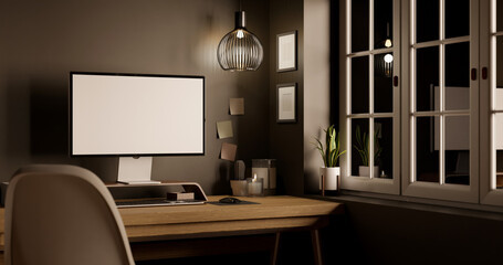 Modern urban dark home workspace near the window with pc computer