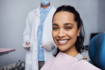 See what good dental health can do for your smile. Portrait of a young woman having dental work...