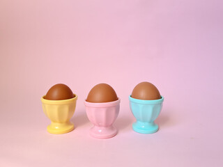 Easter poster and banner template with eggs on light pink background.Greetings and presents for Easter Day in flat lay styling.Promotion and shopping template for Easter