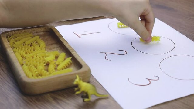 Game for kids to develop fine motor skills.Concept early development, natural toys, fine motor skills. Preschool implement for early education.