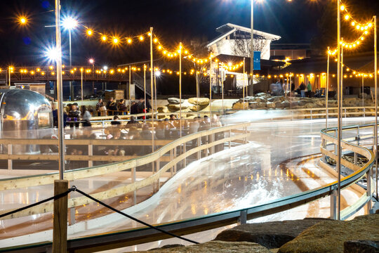 beautiful outdoor ice rink at night with lights