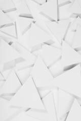 White paper triangles as abstract geometric texture in bright light with soft light shadows, top view, vertical. Simple tender purity dynamic mosaic background in minimal style.