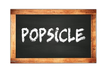Fototapeta premium POPSICLE text written on wooden frame school blackboard.