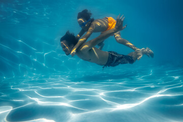 Swimming family, father and child in water, pool.