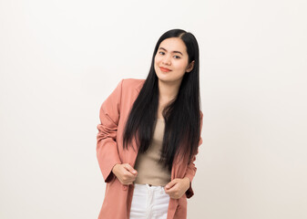 Obraz premium Beautiful asian women in pink fashion suit standing pose looking at camera. Attractive female portrait in white studio. Smiling woman age around 20