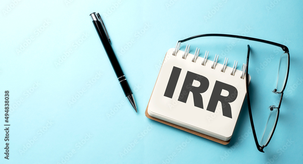 Aufkleber irr internal rate of return text written on a notepad on the blue background