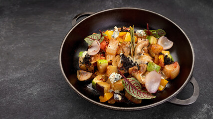 Vegetable stew with mushrooms in a pan