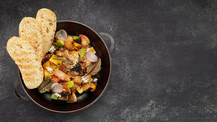Vegetable stew with mushrooms in a pan