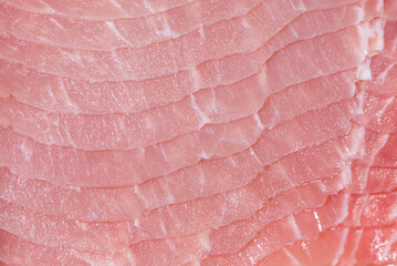 Closeup top view pieces raw meat of fresh pork slices are sliced into thin strips stacked on top of each other