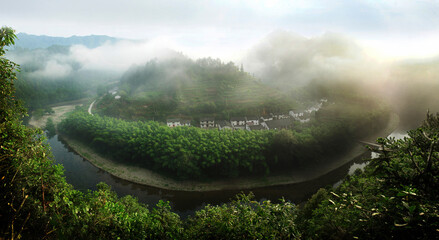 Dream home surrounded by green water and maountain