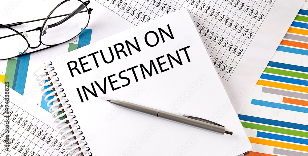 Poster notebook with text return on investment. diagram and white background,business concept