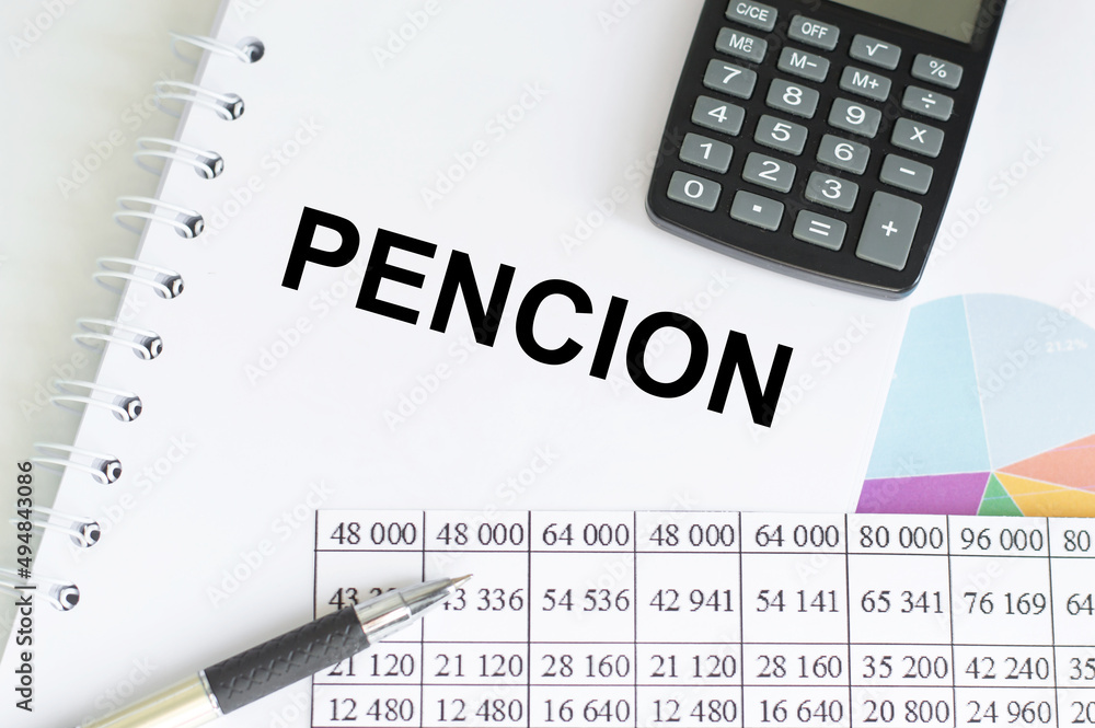 Poster pencion text on notepad on a table next to pen, calculator and reports