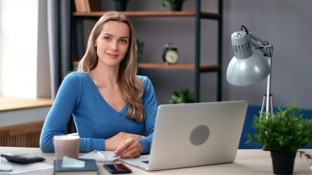 Portrait beautiful business woman posing at workplace with laptop enjoying break positive emotion