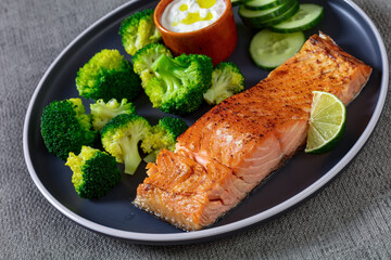roast salmon fillet with boiled broccoli and sauce