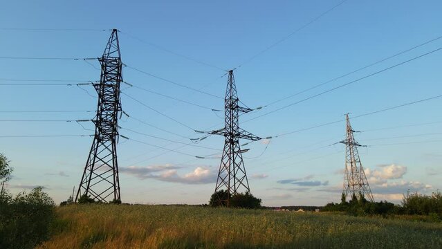 Electric poles on a background of blue sky