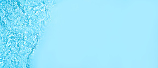 Transparent blue clear water wave surface texture with splashes and bubbles. Abstract summer banner...