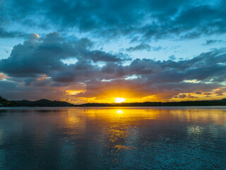 Sunrise and rain clouds waterscape