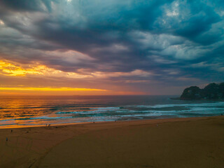 Sunrise reflections and clouds at the seaside with lagoon