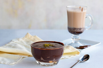 Chocolate pudding or supangle dessert on a white background. With hot chocolate on the side. close up
