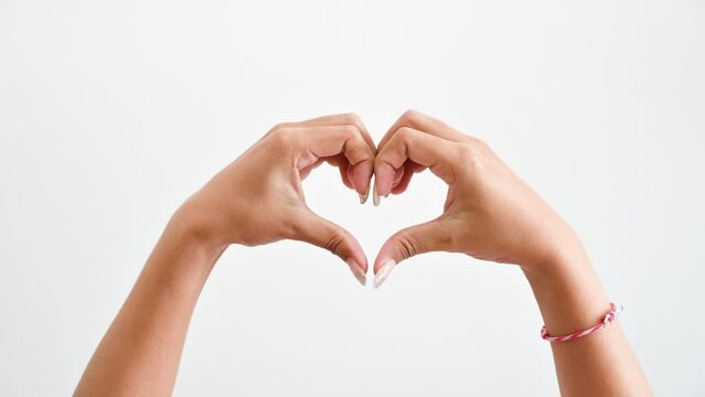Make a hand in the shape of a heart on a white background.
