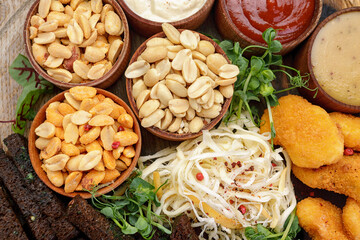 Beer snacks, peanuts, nuggets, squids, sauces, croutons