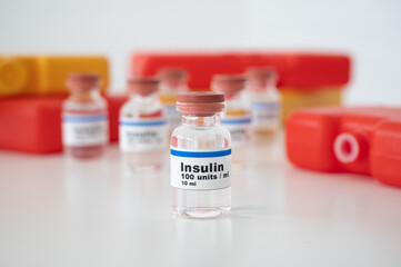 Insulin ampoules with cold packs against a white background: properly cooling and storing insulin. 