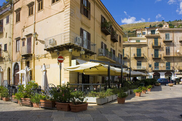 Fototapeta na wymiar Street cafe in Old Town of Monreale, Sicily, Italy