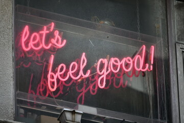 Neon sign let's feel good in red