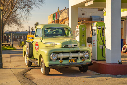 1952 Ford pickup truck at a gas station. Retro car on the main street of Niles.