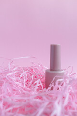 Pink nail polish lies on a pink background. Pink monochrome. Cosmetics store. Gift.  manicure set....