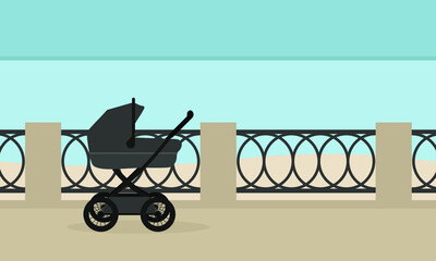 Fototapeta na wymiar Baby stroller on the embankment