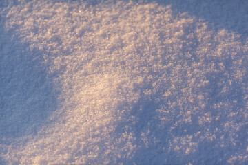 Clean, white snow close-up. Winter background. Snow surface. Fresh fluffy white snow texture.White snowflakes. High quality photo
