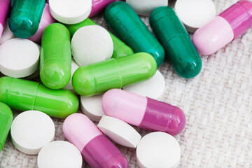 mixture of colorful medicinal capsules or medication in studio shot with copy space